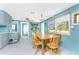 Bright dining room showing the kitchen and decor while featuring a view to another room at 1245 Gulf Blvd, Englewood, FL 34223