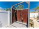 Outdoor shower featuring a wooden frame and privacy fence, perfect for rinsing off after a swim at 1245 Gulf Blvd, Englewood, FL 34223