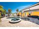 Outdoor patio featuring a pool, spa, entertainment area, and ample seating with mature tropical landscaping at 1245 Gulf Blvd, Englewood, FL 34223