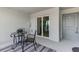 Comfortable balcony with a small table and chairs, perfect for relaxing outdoors at 12470 Wellen Golf St # 207, Venice, FL 34293