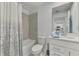 Clean, modern bathroom featuring a shower-tub, a toilet and a stylish vanity with ample counter space, a mirror, and modern fixtures at 12470 Wellen Golf St # 207, Venice, FL 34293