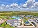 Aerial view of the amazing community amenities: a large resort style pool, tennis courts, and more in a great location at 12470 Wellen Golf St # 207, Venice, FL 34293