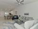 Open-concept living and dining area with modern furnishings and ample natural light at 12470 Wellen Golf St # 207, Venice, FL 34293