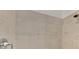 Modern bathroom shower with tiled walls and contemporary fixtures at 12470 Wellen Golf St # 207, Venice, FL 34293