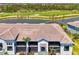Gorgeous waterfront home overlooking a lush green golf course, and mature landscaping at 12470 Wellen Golf St # 208, Venice, FL 34293