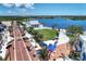 Impressive aerial view highlights the community's brick-paved road, lakefront, and recreational amenities at 12470 Wellen Golf St # 208, Venice, FL 34293