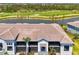 Gorgeous waterfront home overlooking a lush green golf course, and mature landscaping at 12470 Wellen Golf St # 208, Venice, FL 34293