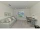 Flex space with a pull-out sofa, desk, chair and window with community views at 12470 Wellen Golf St # 208, Venice, FL 34293