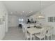 Open floor plan combines kitchen and dining areas at 12470 Wellen Golf St # 208, Venice, FL 34293