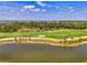 Scenic view of golf course with pond at 12470 Wellen Golf St # 208, Venice, FL 34293