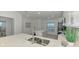 Modern kitchen featuring white cabinets, stainless appliances, and quartz countertops and island at 12470 Wellen Golf St # 208, Venice, FL 34293