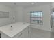 Kitchen island features bar seating and lots of storage at 12470 Wellen Golf St # 208, Venice, FL 34293