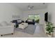 Cozy living room features neutral furniture and decor at 12470 Wellen Golf St # 208, Venice, FL 34293
