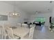 Bright living room connected to outdoor patio through sliding glass doors at 12470 Wellen Golf St # 208, Venice, FL 34293