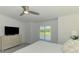 Light and bright main bedroom with a window overlooking the pond and golf course at 12470 Wellen Golf St # 208, Venice, FL 34293