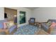 Outdoor patio with comfortable seating arrangements, and a slider leading to the inside of the home at 12470 Wellen Golf St # 208, Venice, FL 34293