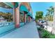 Shops and restaurants line a charming street with a sidewalk for window shopping at 12470 Wellen Golf St # 208, Venice, FL 34293