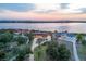 Stunning aerial view of waterfront homes featuring a beautiful backyard and circular driveways at 1275 Bayshore Dr, Englewood, FL 34223