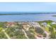 Waterfront property features lush landscaping and ocean view at 1275 Bayshore Dr, Englewood, FL 34223