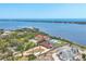Aerial view of homes with manicured lawns along the bay at 1275 Bayshore Dr, Englewood, FL 34223