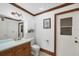 Bathroom featuring classic fixtures, wood trim, and traditional design elements at 1275 Bayshore Dr, Englewood, FL 34223