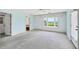 Bedroom with water views and natural light, featuring plush carpet and a private entrance at 1275 Bayshore Dr, Englewood, FL 34223