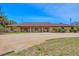 Spacious one-story home features a circle drive and traditional design with lots of curb appeal at 1275 Bayshore Dr, Englewood, FL 34223
