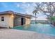 Large garage with ample parking and waterfront views in the distance at 1275 Bayshore Dr, Englewood, FL 34223