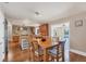 Eat in kitchen with views of the pool area, a large island, and custom cabinetry at 1275 Bayshore Dr, Englewood, FL 34223