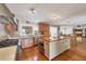 Modern kitchen features a large center island, stainless appliances, and hardwood floors at 1275 Bayshore Dr, Englewood, FL 34223