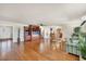 Inviting living area with hardwood floors, media center, and a view of the open concept kitchen at 1275 Bayshore Dr, Englewood, FL 34223