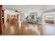Open living space with hardwood floors, ceiling fan, and access to the kitchen and a great ocean view at 1275 Bayshore Dr, Englewood, FL 34223