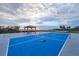 Pickle ball court with covered table, net, and sunset view at 1275 Bayshore Dr, Englewood, FL 34223