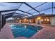 Screened pool area with brick pavers and access to home's living space at 1275 Bayshore Dr, Englewood, FL 34223