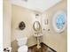 Unique powder room featuring striking tile floor and pedestal sink at 1275 Bayshore Dr, Englewood, FL 34223