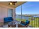 Relaxing screened-in balcony with comfortable seating and panoramic views of the bay at 13113 Gasparilla Rd # A503, Placida, FL 33946