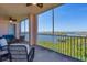 Screened balcony with water view and comfortable seating, ideal for enjoying the coastal scenery at 13113 Gasparilla Rd # A503, Placida, FL 33946