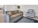 Cozy living room with a sofa, recliner, and plush carpet, offering a relaxing space at 13113 Gasparilla Rd # A503, Placida, FL 33946