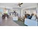 Open-concept living space with eat-in kitchen, comfortable seating, and tile flooring at 13113 Gasparilla Rd # A503, Placida, FL 33946