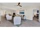 Comfortable living room with plush seating, neutral tones, and a scenic water view artwork at 13113 Gasparilla Rd # A503, Placida, FL 33946