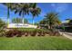 Entrance to the Boca Vista Harbor community surrounded by lush landscaping and palm trees at 13113 Gasparilla Rd # A503, Placida, FL 33946