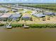 A waterfront property boasts a private dock and boat lift, perfect for boating enthusiasts with pool at 14556 Gaspar Loop, Port Charlotte, FL 33981