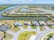 Panoramic aerial view of a residential community featuring canal access and waterfront homes at 14556 Gaspar Loop, Port Charlotte, FL 33981