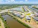 Stunning aerial view of waterfront homes featuring private docks and boat lifts and beautiful landscaping at 14556 Gaspar Loop, Port Charlotte, FL 33981