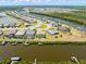 Gorgeous aerial view of waterfront homes with private docks along a scenic waterway and lush surroundings at 14556 Gaspar Loop, Port Charlotte, FL 33981