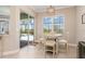 Cozy dining area with views of the pool and easy access to outdoor entertainment space at 14556 Gaspar Loop, Port Charlotte, FL 33981