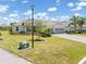 Well maintained home featuring tile roof, paver driveway and lush landscaping at 14556 Gaspar Loop, Port Charlotte, FL 33981