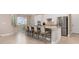 Spacious kitchen boasts a large island with seating, granite countertops, and stainless steel appliances at 14556 Gaspar Loop, Port Charlotte, FL 33981