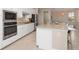 Well-equipped kitchen featuring stainless appliances, granite counters, ample storage, and a breakfast bar at 14556 Gaspar Loop, Port Charlotte, FL 33981
