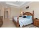 Comfortable main bedroom with a calming color palette, and tiled floors for easy maintenance at 14556 Gaspar Loop, Port Charlotte, FL 33981